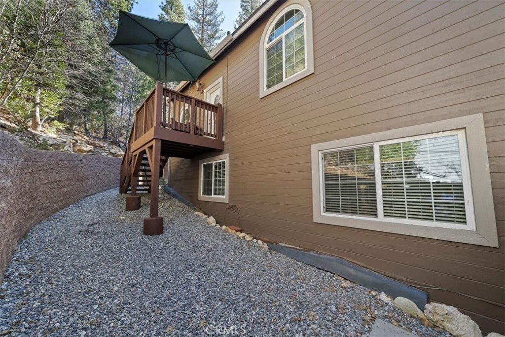 27312 Little Bear Road Lake Arrowhead, CA 92352 - Photo 41 of 47 a house view with a backyard space