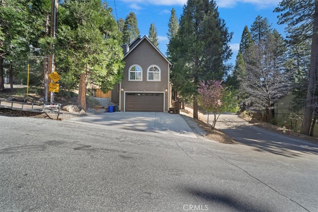 27312 Little Bear Road Lake Arrowhead, CA 92352 - Photo 9 of 47 a view of a house with a yard and large trees