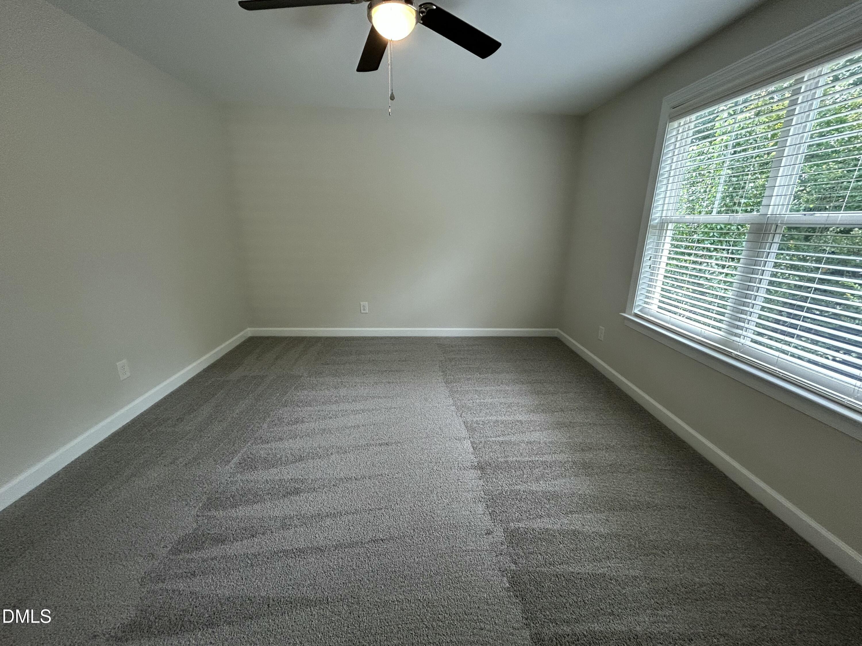 3837 Cumberland Pond Road Raleigh, NC 27606 - Photo 26 of 33 an empty room with a window
