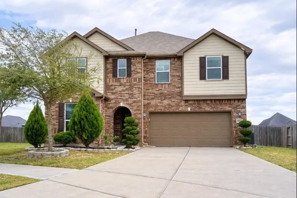 a front view of a house with yard