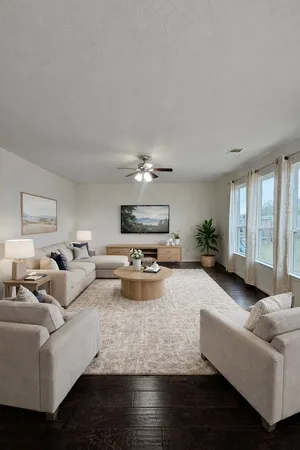 a living room with furniture and a chandelier