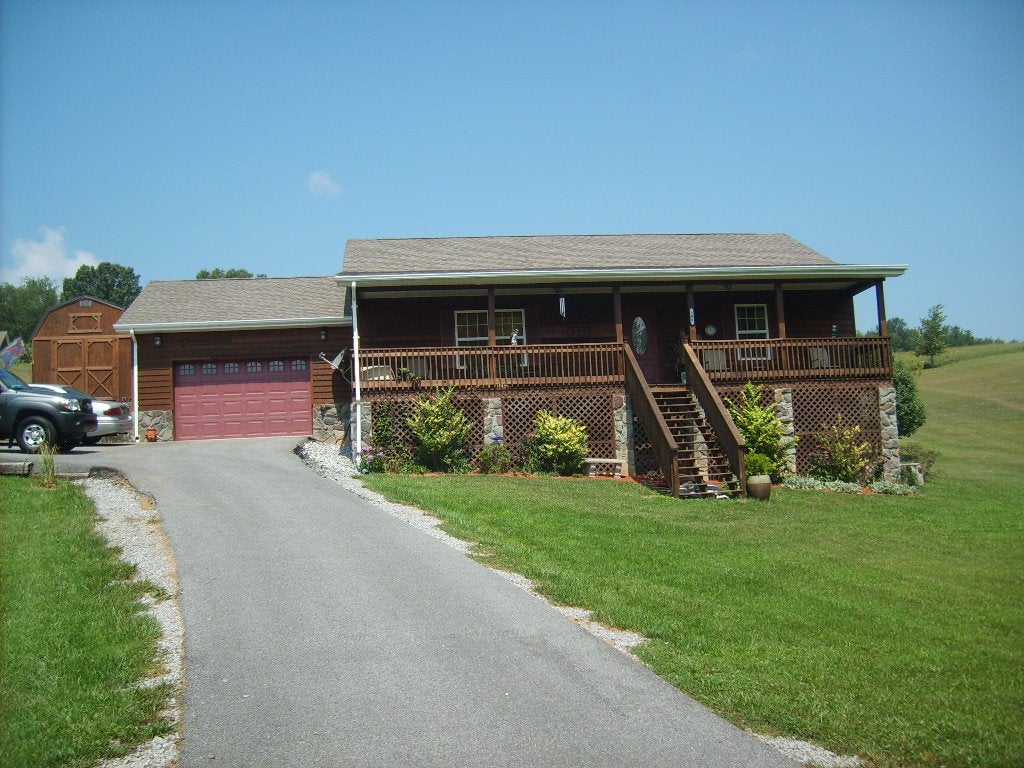 586 Pinhook Road Peterstown, WV 24963 - Photo 19 of 23 Paved driveway, side entrance to family room next to garage.