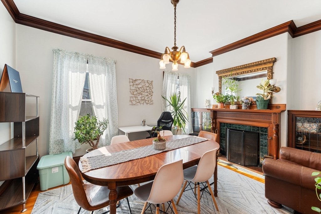 52 Underwood Street Fall River, MA 02720 - Photo 14 of 42 a dining room with furniture a chandelier and wooden floor