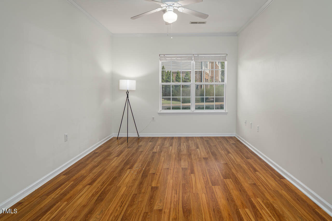 2610 Oldgate Drive, Unit 101 Raleigh, NC 27604 - Photo 15 of 23 wooden floor in an empty room with a window