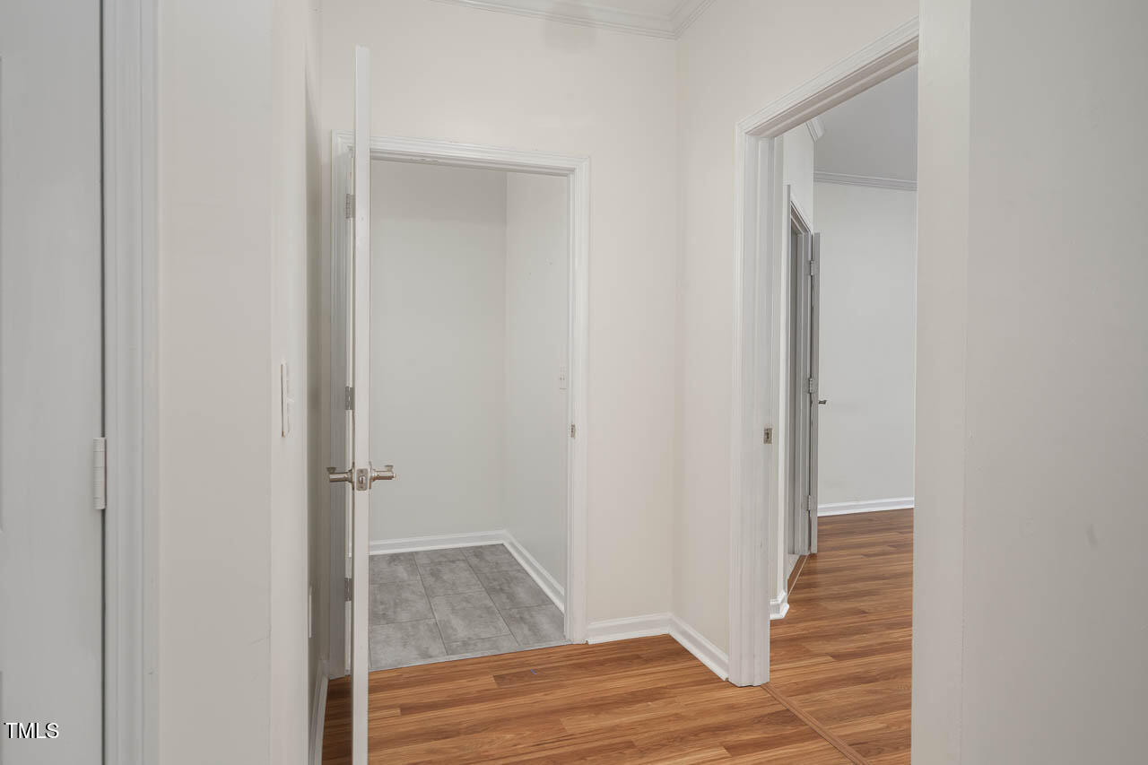 2610 Oldgate Drive, Unit 101 Raleigh, NC 27604 - Photo 5 of 23 a view of walk in closet with wooden floor