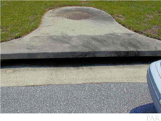 6843 Cedar Ridge Circle Milton, FL 32570 - Photo 11 of 11 City Drainage to right of driveway making home high and dry.