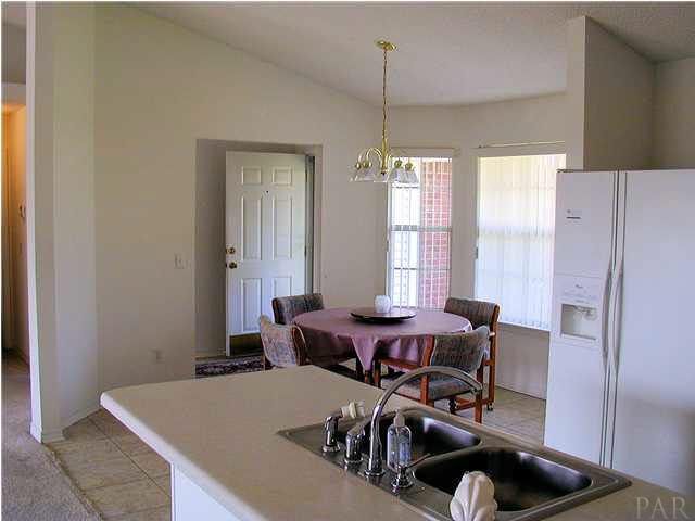 6843 Cedar Ridge Circle Milton, FL 32570 - Photo 2 of 11 Kitchen Breakfast Bar/Dining Room and front Entry