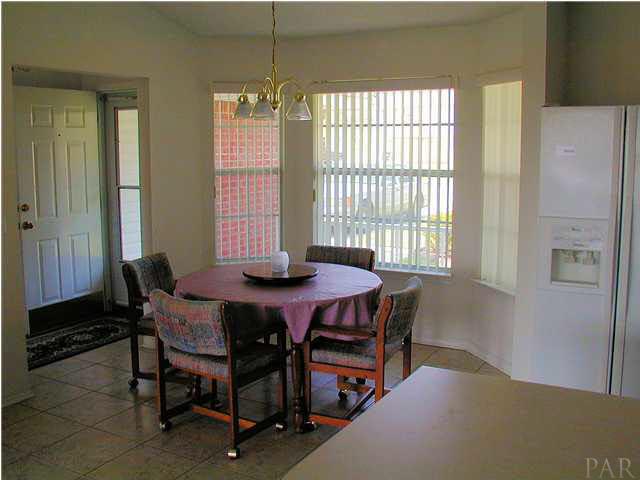 6843 Cedar Ridge Circle Milton, FL 32570 - Photo 4 of 11 Dining Room adjoins Kitchen. Bay window overlooks front porch and front yard.