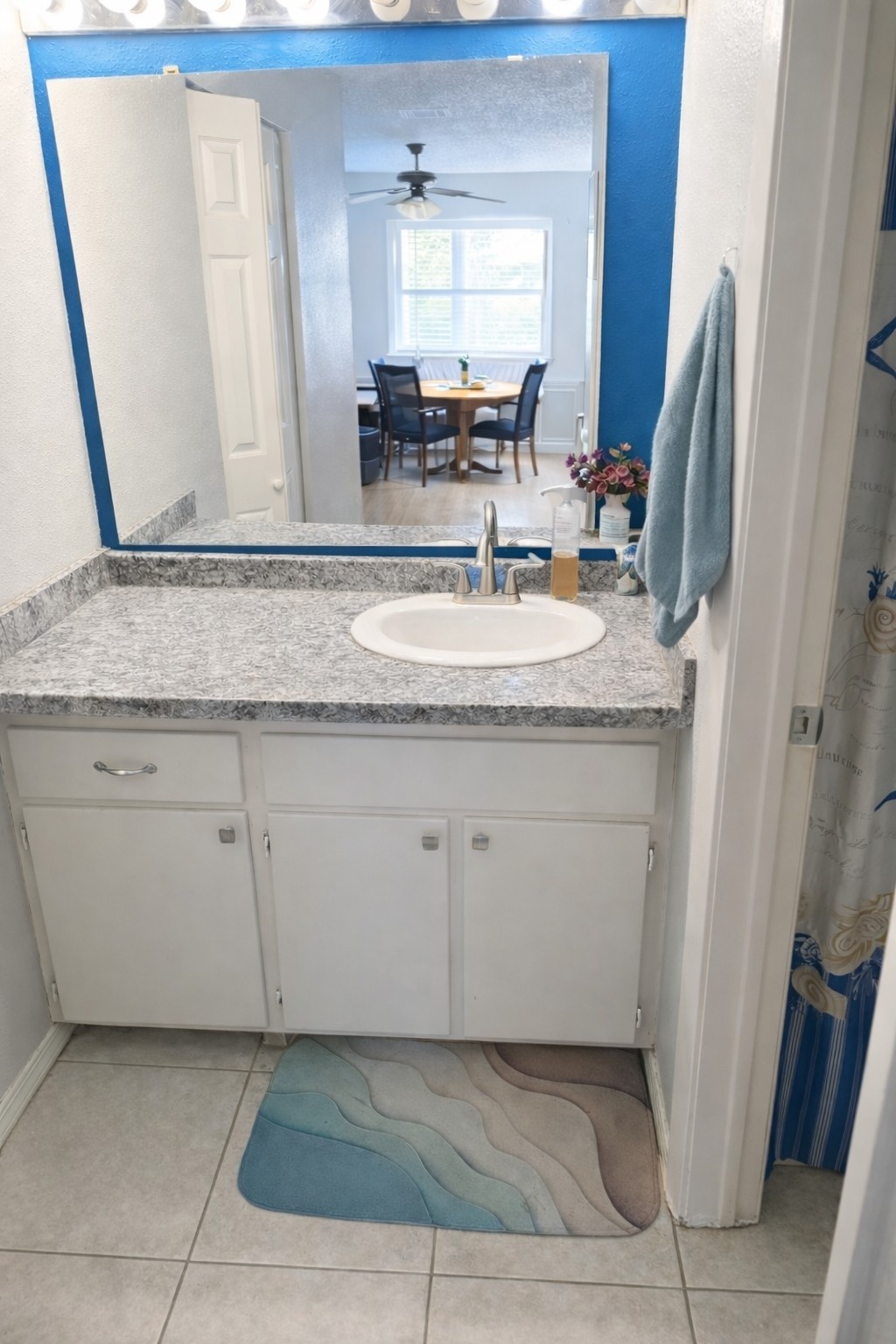3546 Ocee Street Houston, TX 77063 - Photo 12 of 22 a bathroom with a granite countertop sink and a mirror