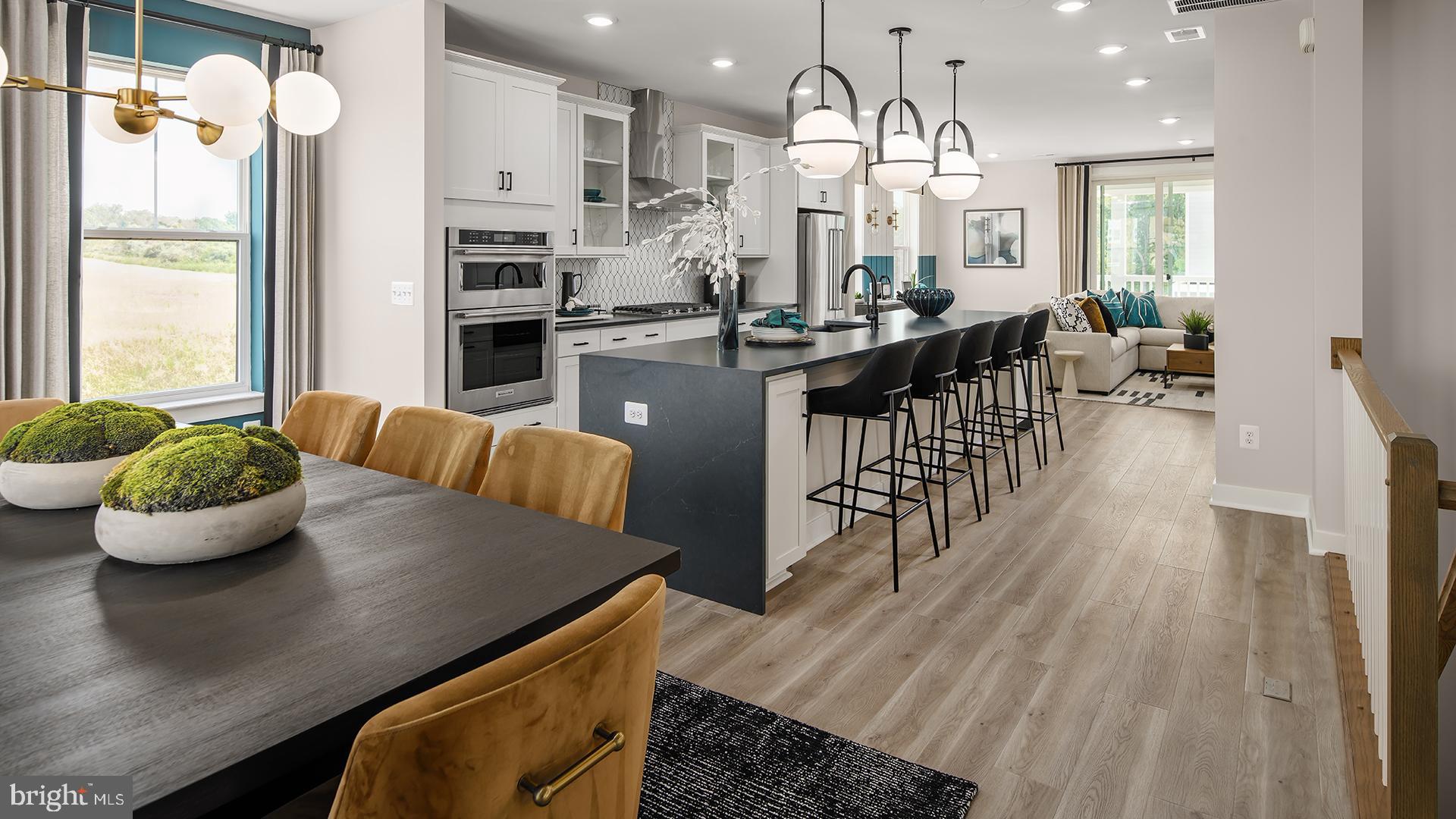 45175 Drowes Terrace Sterling, VA 20166 - Photo 4 of 14 a view of a dining room with furniture and wooden floor