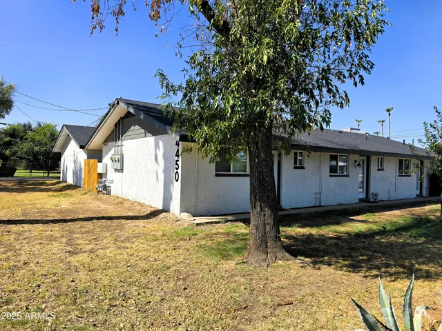 a view of a house with a yard
