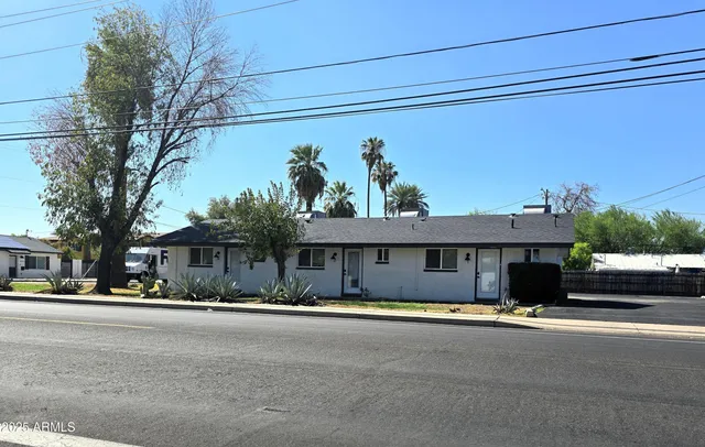a view of a street with a car parked