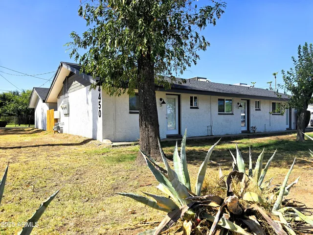 a house with trees in front of it