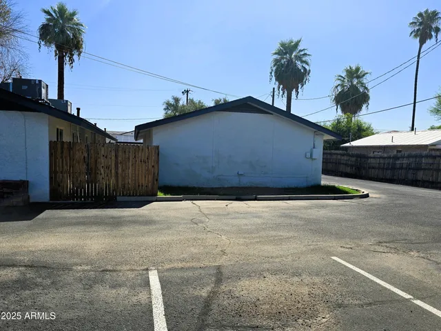 a front view of a house with a road