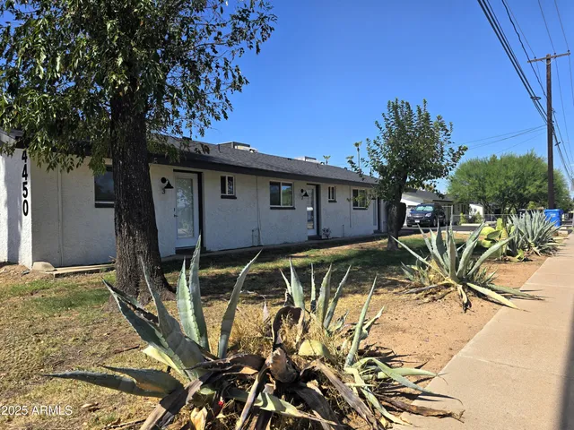 a view of a backyard with a patio