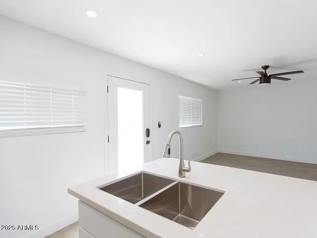 a kitchen with a sink and cabinets