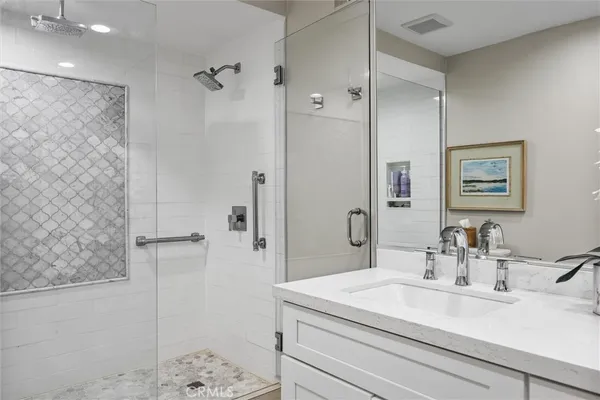 a bathroom with a double vanity sink mirror and double