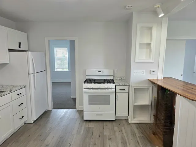 a view of a livingroom and a fireplace