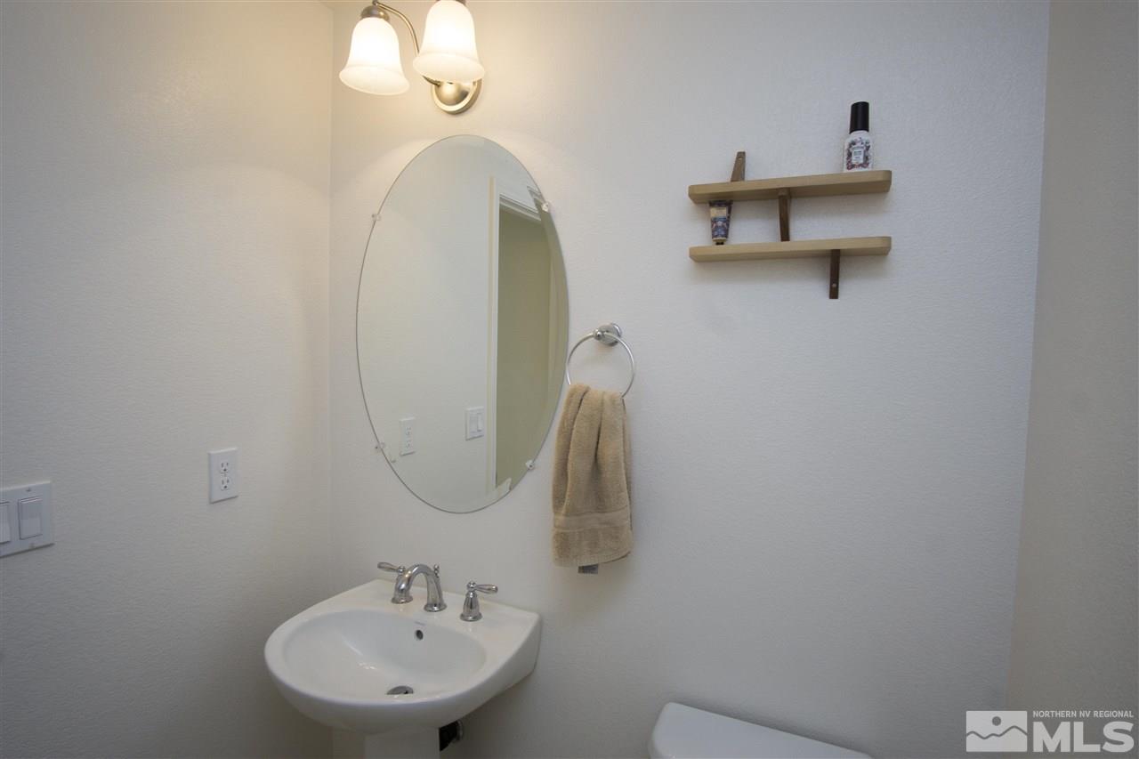 2090 Half Dome Drive Reno, NV 89521 - Photo 9 of 22 a bathroom with a sink and a mirror