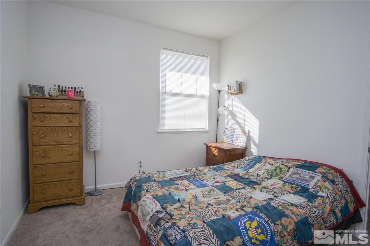 2090 Half Dome Drive Reno, NV 89521 - Photo 10 of 22 a bedroom with a bed and a dresser