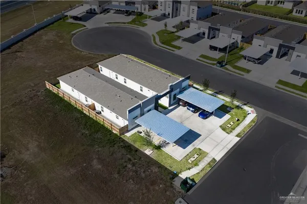 an aerial view of house with yard