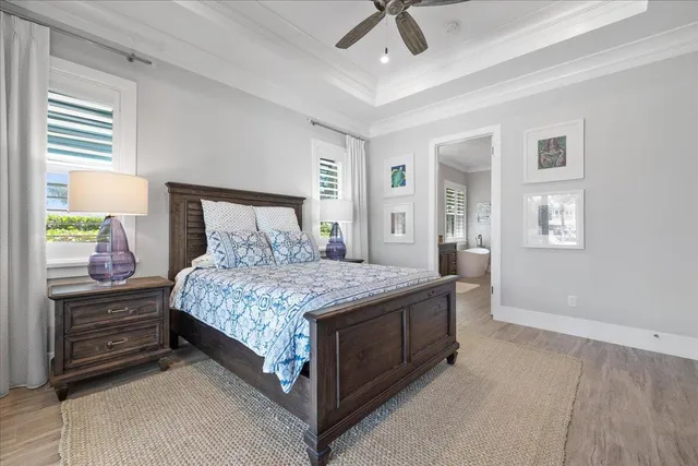 a spacious bathroom with a granite countertop sink a toilet a mirror and a window