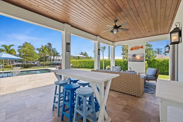 a view of a lake with a table and chairs