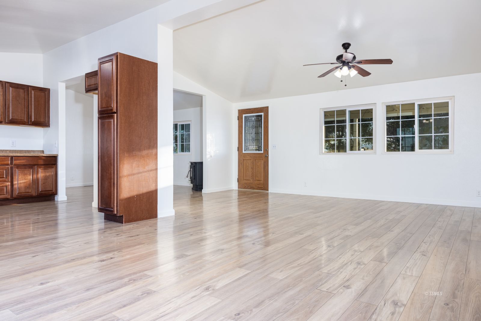 828 North Victor Street Ridgecrest, CA 93555 - Photo 9 of 50 a view of livingroom with hardwood floor and a ceiling fan