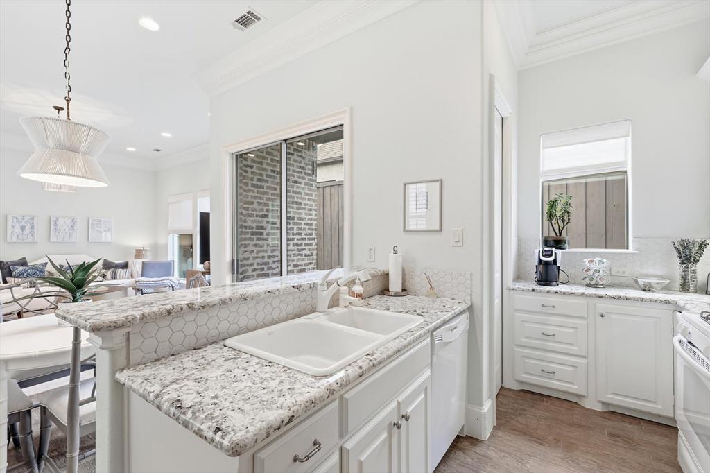 476 Hidden Valley Lane Coppell, TX 75019 - Photo 28 of 40 a bathroom with a granite countertop sink and a bathtub