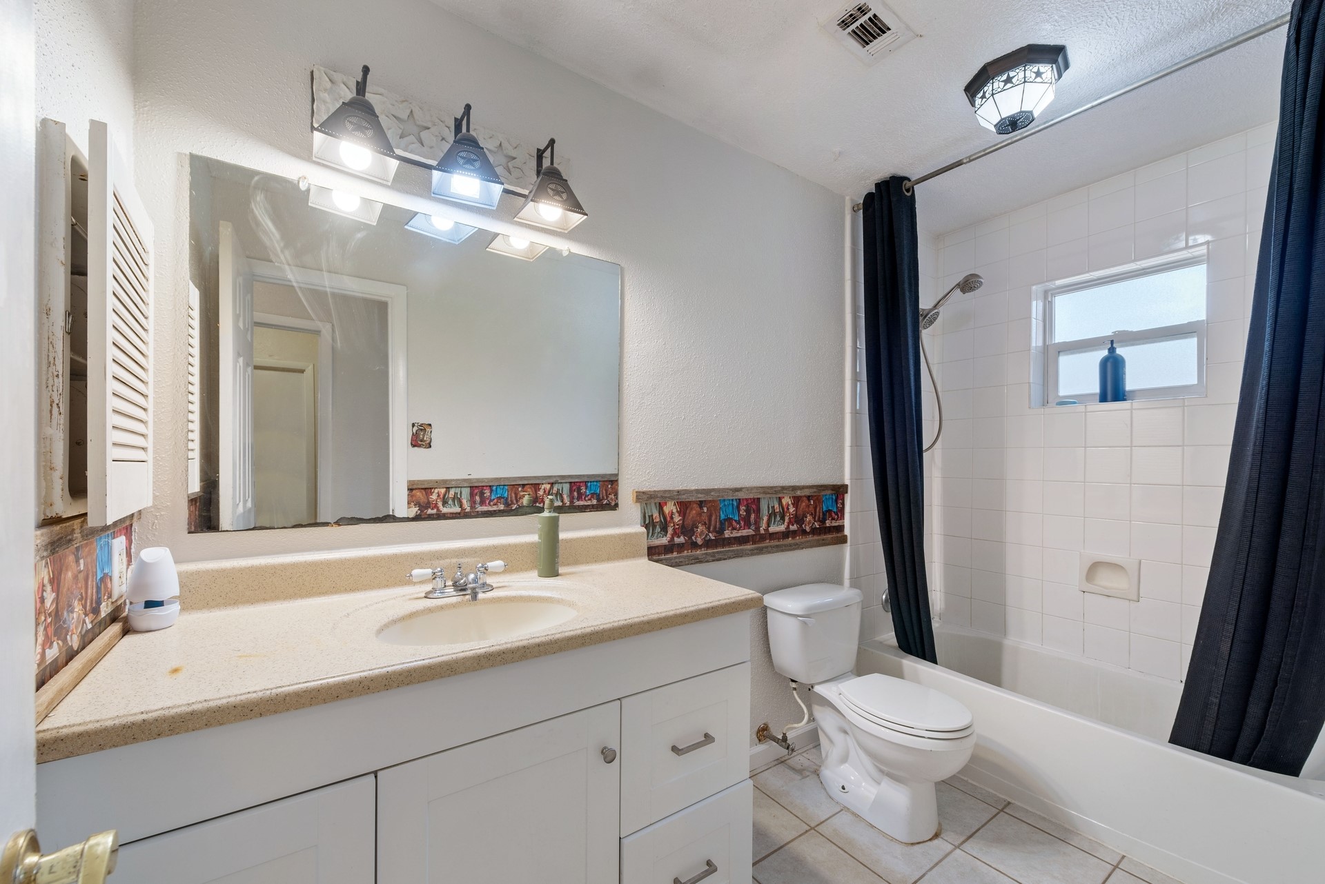 9622 Birsay Street Spring, TX 77379 - Photo 9 of 17 Secondary bathroom serves the living areas and the extra bedrooms.