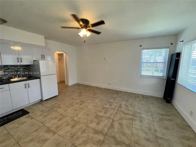 a view of cabinets and window