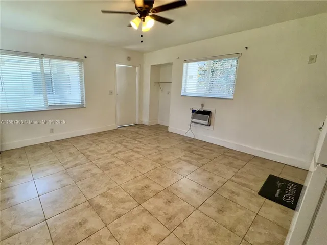 a view of an empty room with a window
