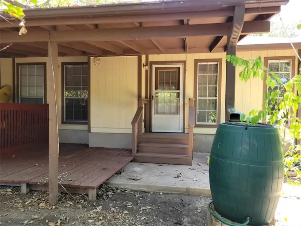 a view of a porch with wooden floor