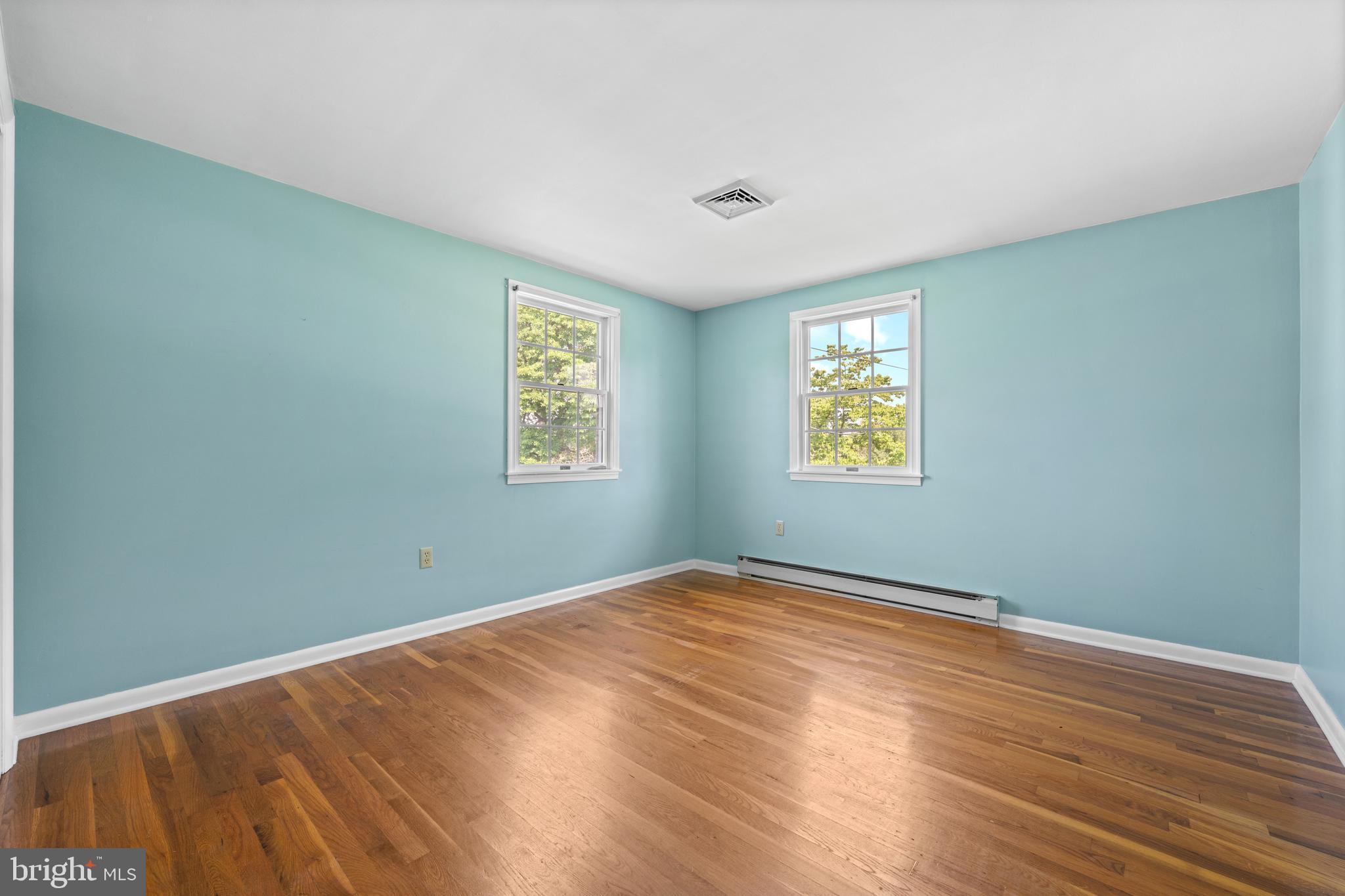 258 Monacy Road Coatesville, PA 19320 - Photo 40 of 54 a view of an empty room with wooden floor and a window