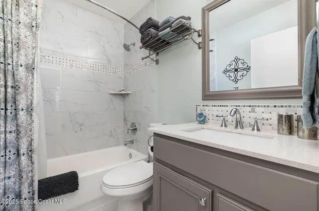 a bathroom with a sink a toilet and a bathtub