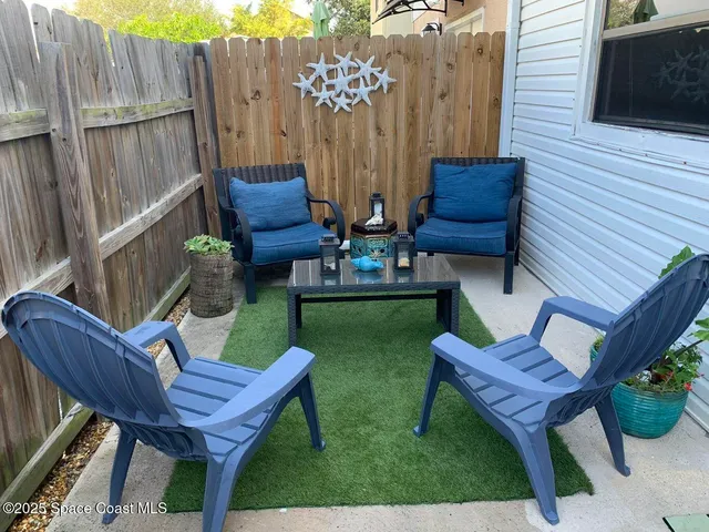a view of a backyard with furniture
