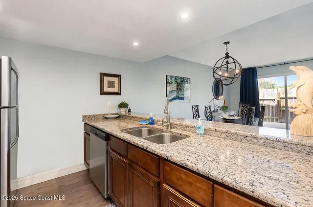 a view of living room with granite countertop furniture and fireplace