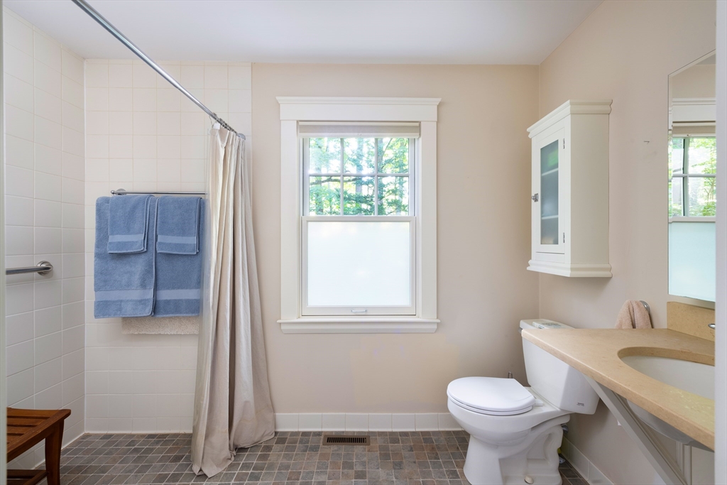 160 Allen Avenue Newton, MA 02468 - Photo 11 of 19 a bathroom with a toilet sink and mirror