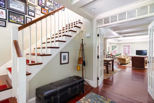 a view of entryway and hall with wooden floor
