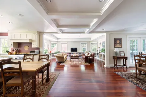 a very nice looking living room with furniture wooden floor and a fireplace