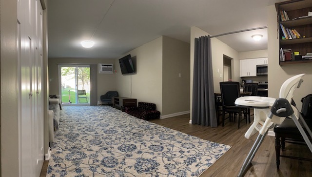 125 West Elk Trail, Unit 124 Carol Stream, IL 60188 - Photo 3 of 9 a living room with furniture and a table