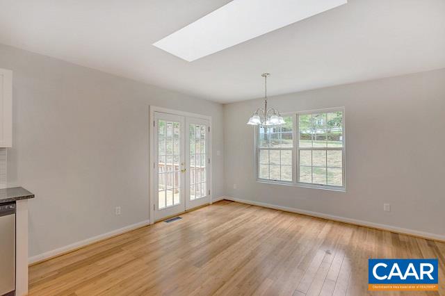 1 Brougham Road Palmyra, VA 22963 - Photo 8 of 50 an empty room with wooden floor and windows