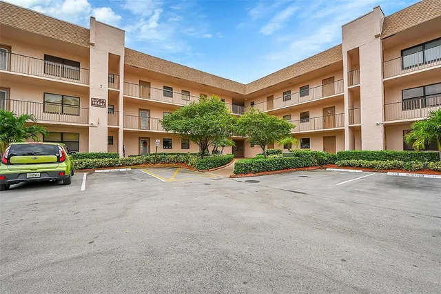 a view of swimming pool with outdoor seating and deck