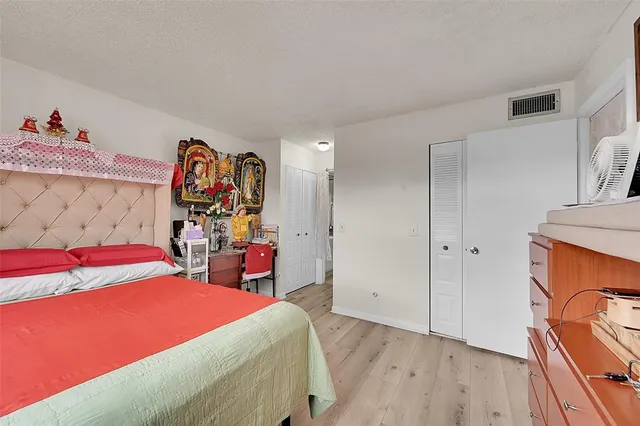 a view of a street with a building in the background