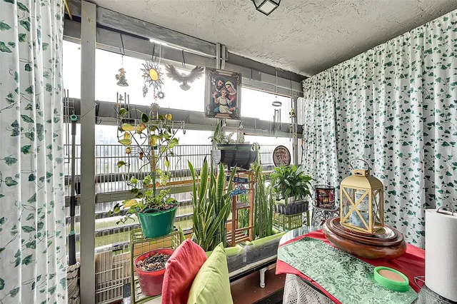 a view of living room with furniture and window