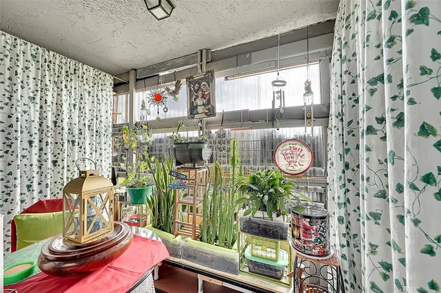 a hallway with a book shelf and a book shelf