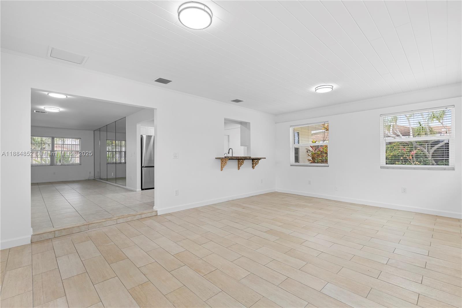 1517 Southeast Pitcher Road Port St. Lucie, FL 34952 - Photo 14 of 26 a view of an empty room with a window