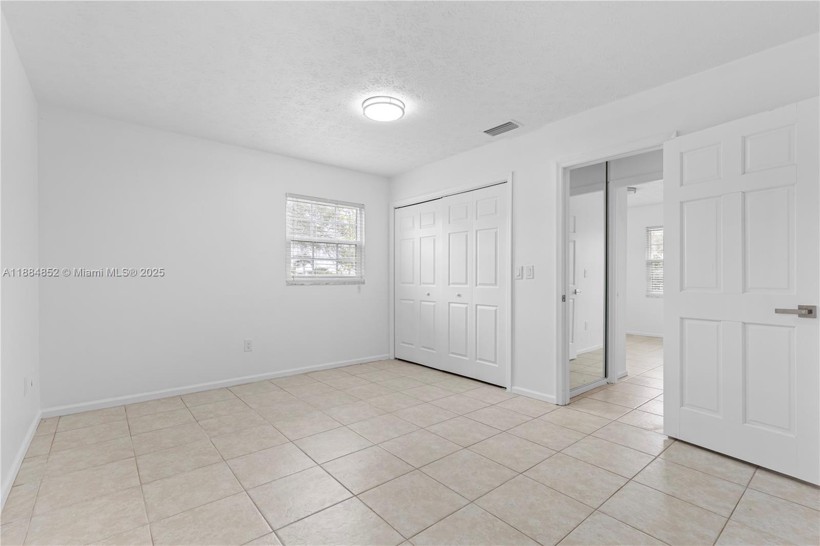 1517 Southeast Pitcher Road Port St. Lucie, FL 34952 - Photo 15 of 26 a view of an empty room and window
