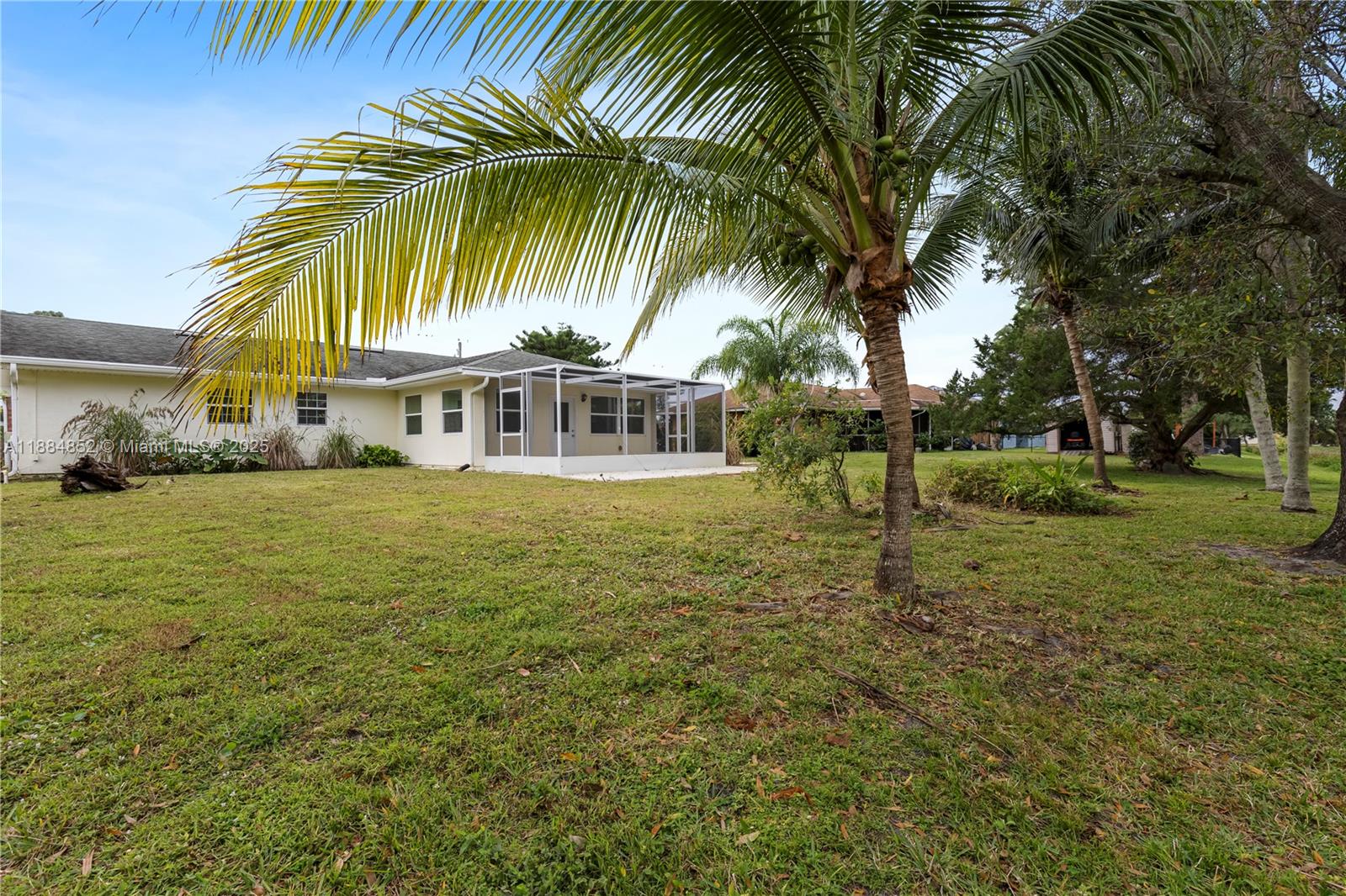 1517 Southeast Pitcher Road Port St. Lucie, FL 34952 - Photo 25 of 26 a view of a house with a garden
