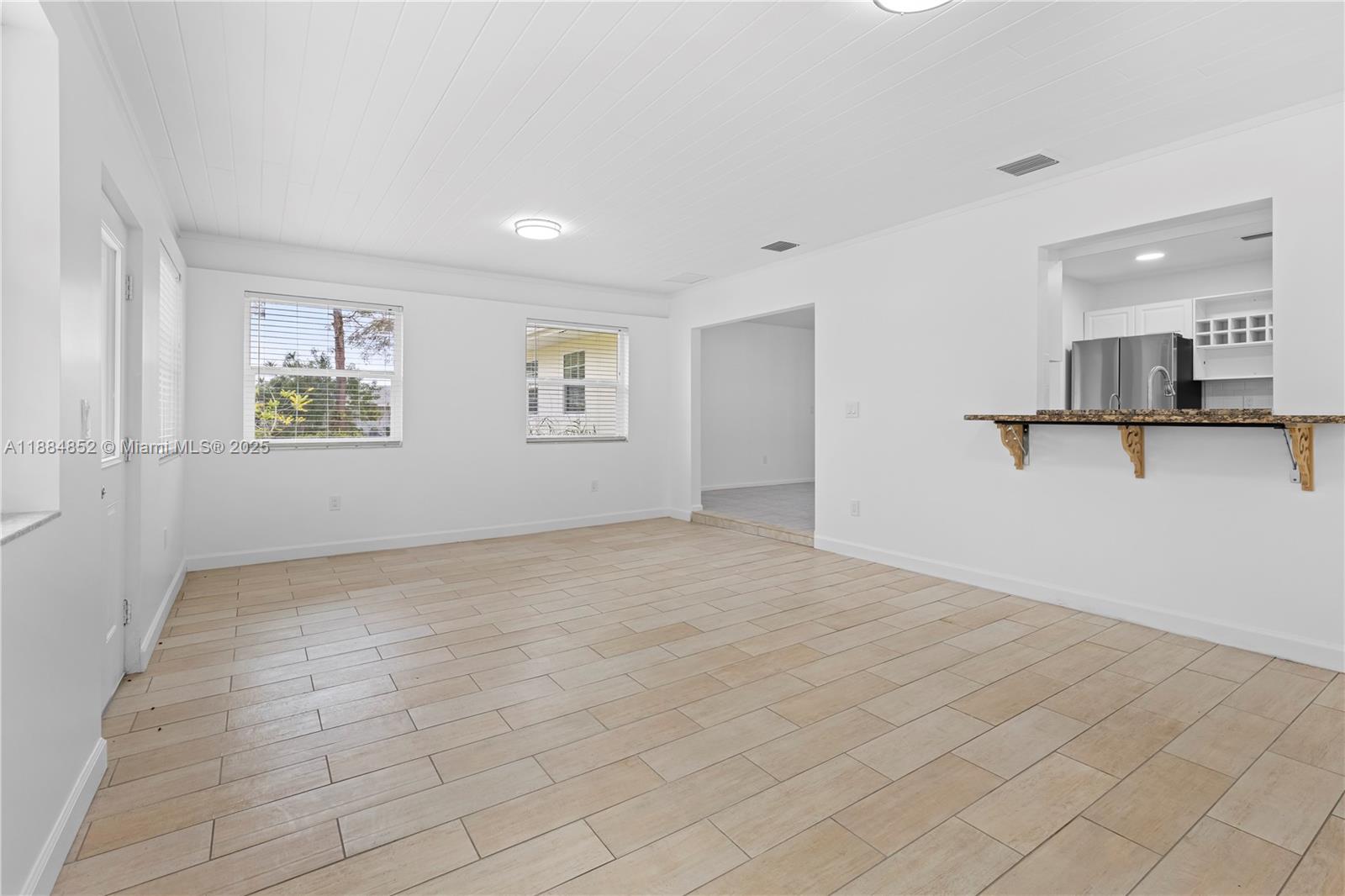 1517 Southeast Pitcher Road Port St. Lucie, FL 34952 - Photo 8 of 26 a view of an empty room with a window